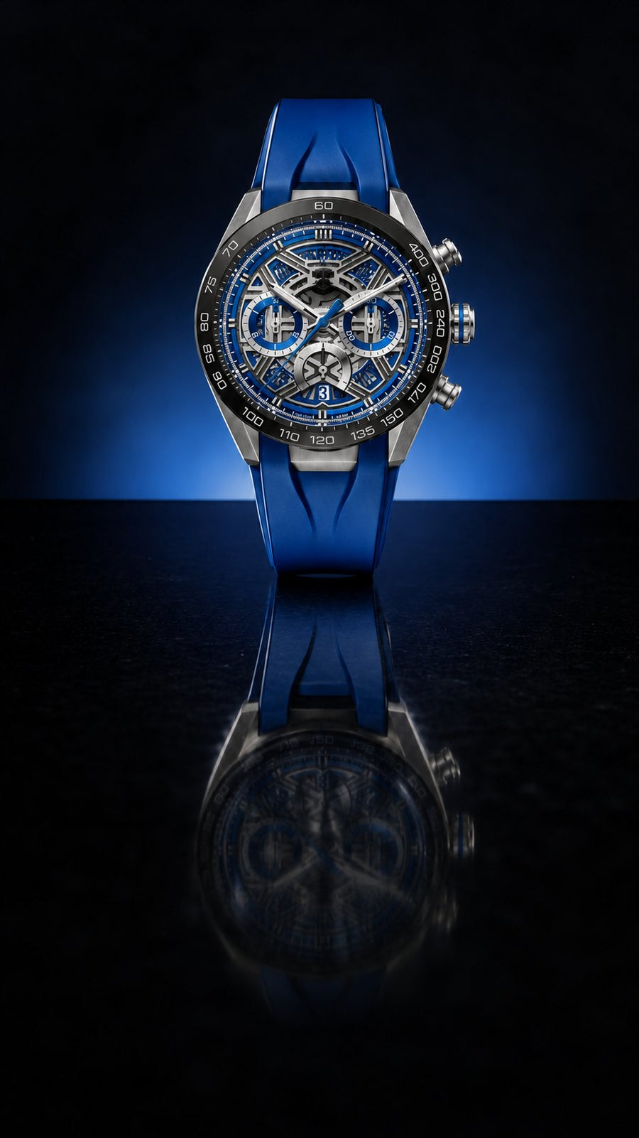 Blue-dial chronograph on a dark reflective surface